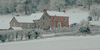 Snow covered home in rural UK