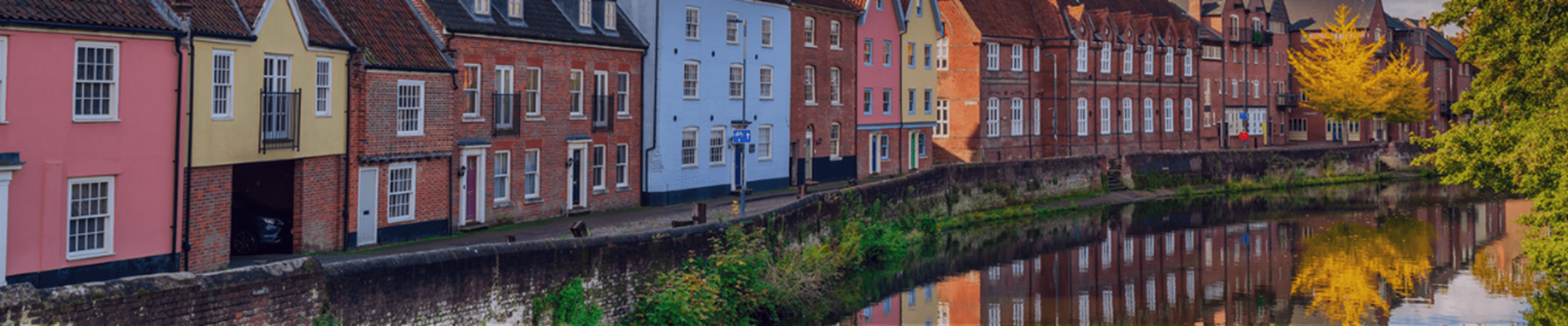 Quay Side architecture reflected in River Wensum. Norwich, Norfolk. England